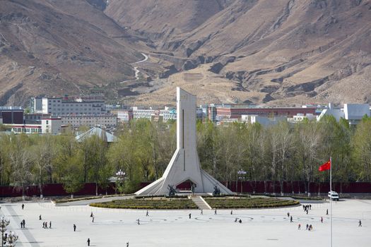 Monument to the Peaceful Liberation of Tibet. The 37-metre-high concrete monument is shaped as an abstract Mount Everest and its name is engraved with the calligraphy of former president Jiang Zemin