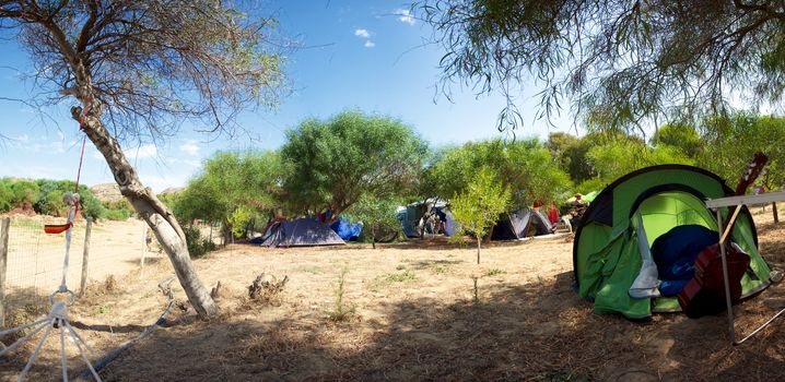 Sicily, panorama of a campsite in Sicily during the summer holidays. Relax, creative and musical time.
