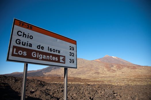 Teide in the beautiful landscape of the national park - With sign road towards the Los Gigante sightseen