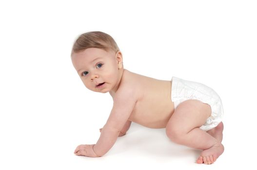 Side view of little crawling baby in white background