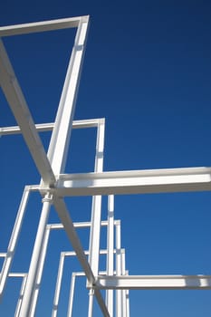 Building in construction, Metallic structure against a clear sky