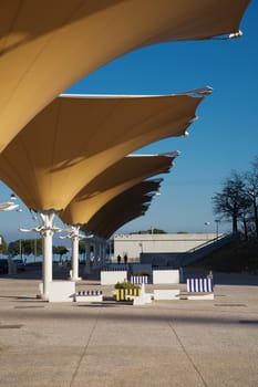 Hot summer under a parasol at former Expo 98 area, todays Park of Nation place in Lisbon, Portugal