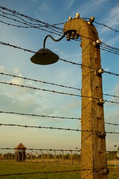 Barbed wire fence in Auschwitz II-Birkenau Concentration Camp in Poland near Krakow.