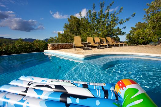 Air bed floating on a swimming pool in Ibiza