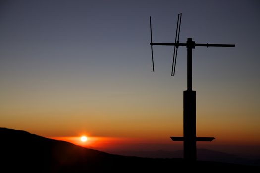 Sunset from the Etna with clear sky and a communication device