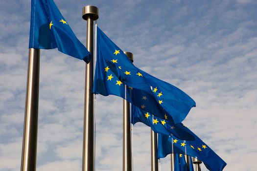 European flags in Brussels with a blue sky, Schuman in Brussels