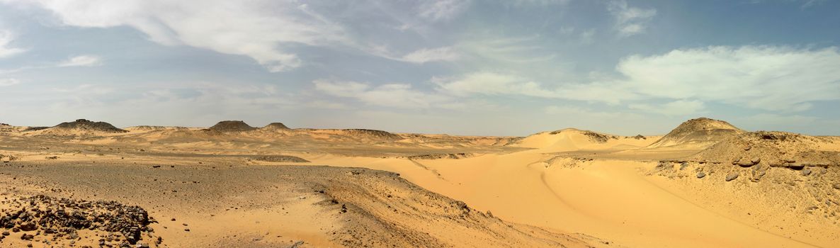 Panoramic view. Sandy and deserted landscape in the Libyan desert.