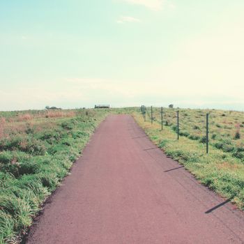 Landscape of the road to the hill with retro filter effect