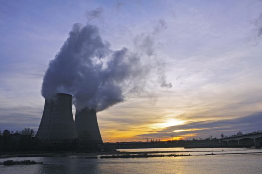 Nuclear power station in France on background sunset