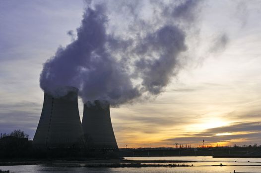 Nuclear power station in France on background sunset