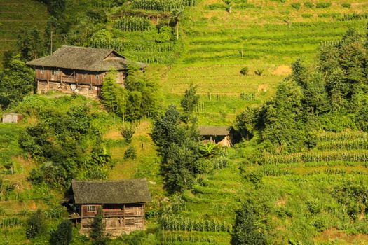 Old wooden village buildings in hill