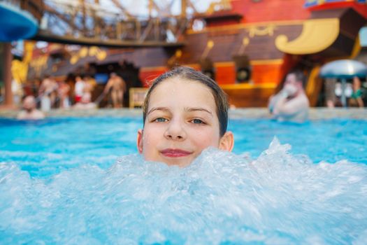 Activities on the pool. Cute girl in swimming pool