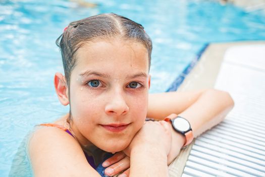 Activities on the pool. Cute girl in swimming pool