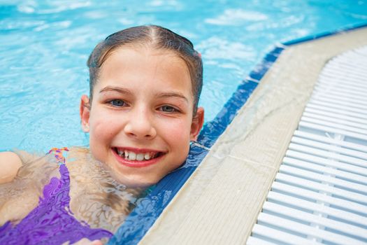 Activities on the pool. Cute girl in swimming pool