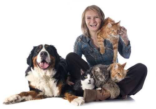 woman and pet in front of white background