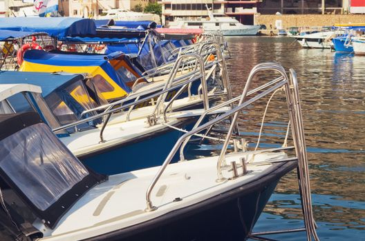 motor boats over harbor pier