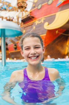 Activities on the pool. Cute girl in swimming pool