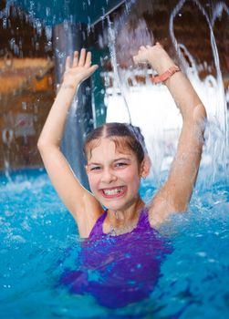 Activities on the pool. Cute girl in swimming pool