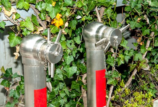 Fire hose nozzle in the garden.