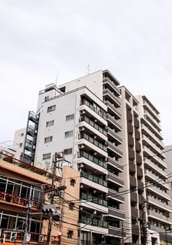 Building with traffic lights close together.