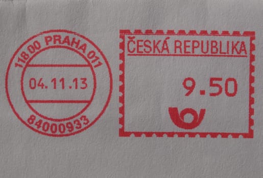 red ink postage meter from Prague over white envelope