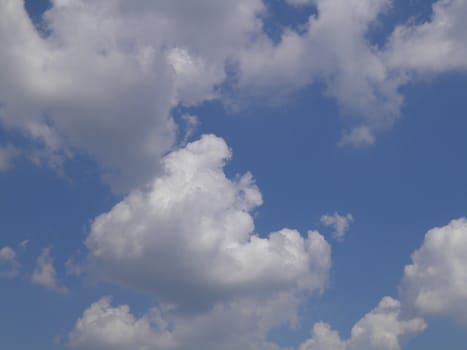 Blue sky with white clouds useful as a background