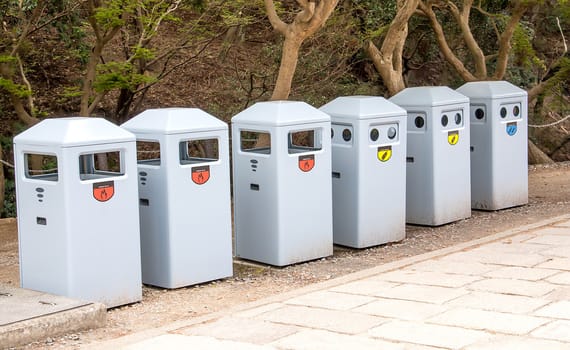 six recycle bins in  forest to the public.