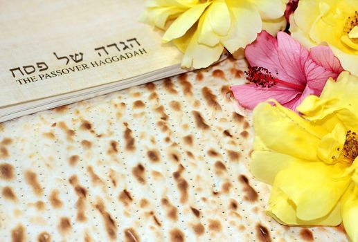 spring holiday of Passover and its attributes, with matzo and Haggadah in Hebrew - Happy Passover