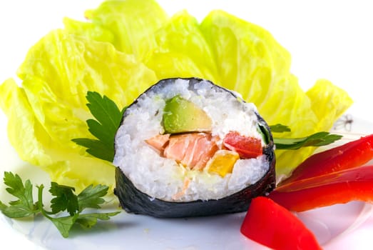 One piece of sushi on decorated plate isolated on white background