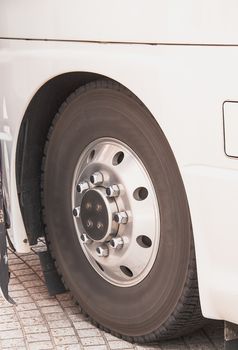 Front wheels of the bus In the side view.