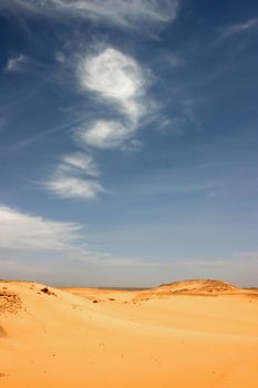 Sandy and deserted landscape in the Libyan desert.