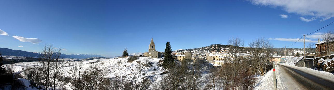 Panboramic view of a typical village at Pyrénées at the winter with snow