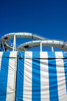 Roller coaster in Brighton under a blue sky