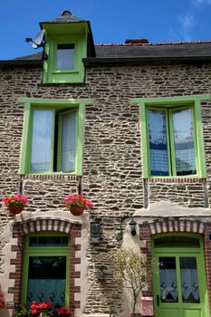 Facade of traditional breton houses without shutters, france