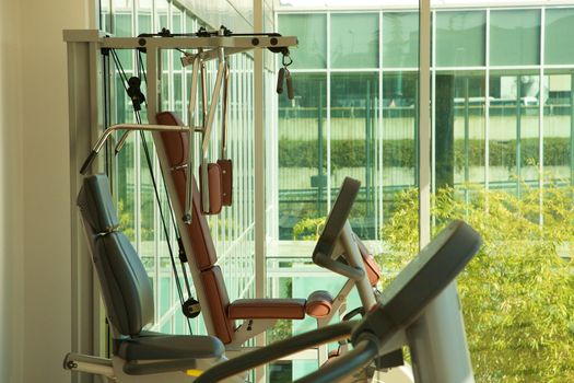 A gym and stationary equipment in a hotel in Italy