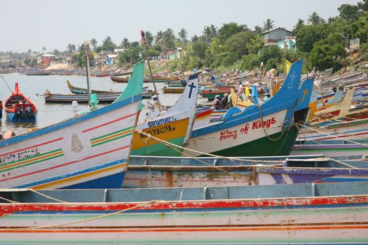 Detail of colored ships on the beach in Kerala State