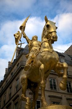 The golden statue of Saint Joan of Arc in Paris, France.