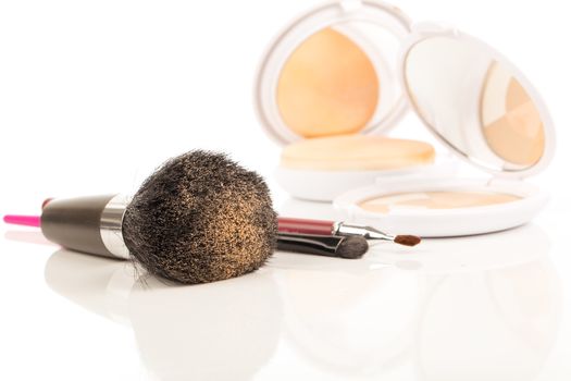 brush and powder isolated over white