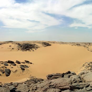 Sandy and deserted landscape in the Libyan desert.