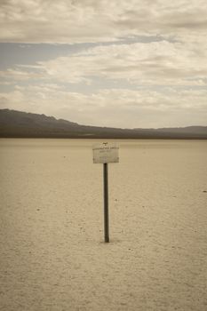 Sign restricted area keep out in the desert of Nevada, retro style image