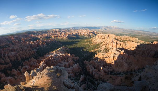 Panoramic view to one of the amphitheatres of Bryce Canyon late afternoon with sunset