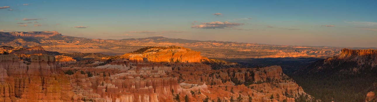 Panoramic view to one of the amphitheatre of Bryce Canyon late afternoon with sunset