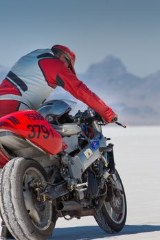 BONNEVILLE SALT FLATS, UTAH,  SEPTEMBER 8: Unidentified driver holding his super bike during the World of Speed 2012 in the state of Utah.