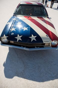BONNEVILLE SALT FLATS, UT, SEPTEMBER 8: Front side of a vintage Ford converted into a Hot Rod with American flag painted on the car during the World of Speed. Utah 2012.