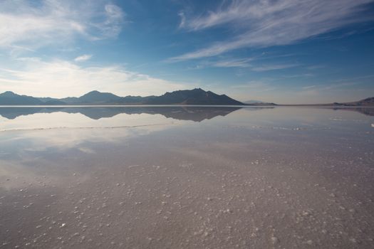 Bonneville Salt Flats International Speedway. Mystical reflection of desert mountains in sunset water