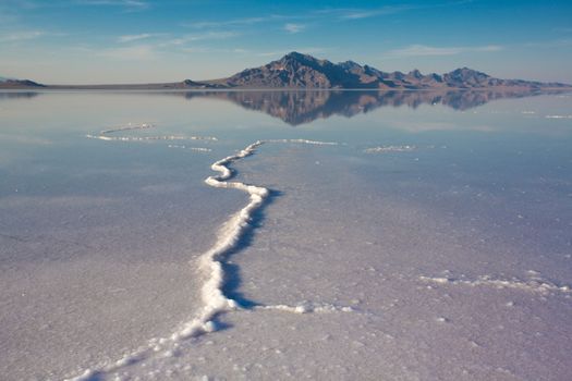 Bonneville Salt Flats International Speedway. Mystical reflection of desert mountains in sunset water