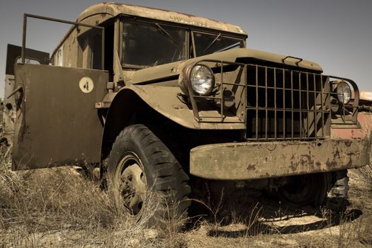 An old military vehicle abandoned in a field in Utah