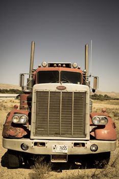 Old rusty truck abandoned along an isolate aea in the Utah