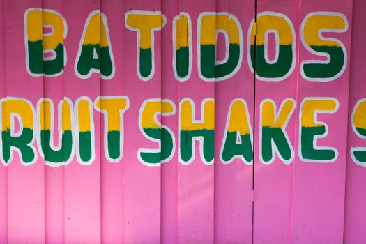 Colorful food sign painted on a wall, closeup in costa rica