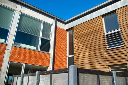 Modern design house with bricks and wooden facade